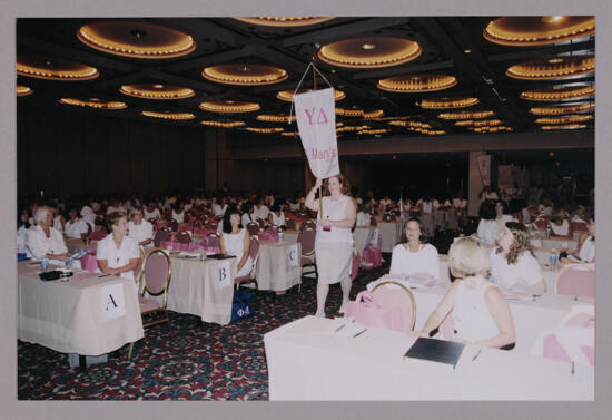 Sue Pero Carrying Upsilon Delta Chapter Banner at Convention Photograph 1, July 4-8, 2002 (image)