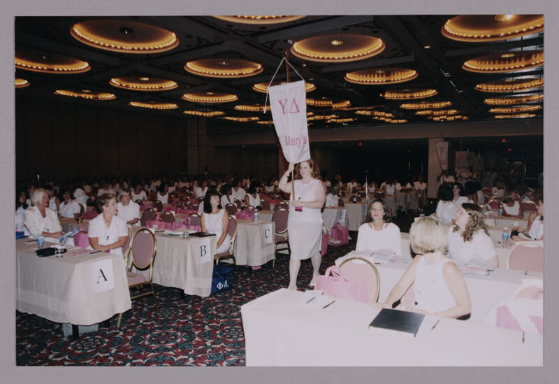 Sue Pero Carrying Upsilon Delta Chapter Banner at Convention Photograph 1, July 4-8, 2002 (Image)