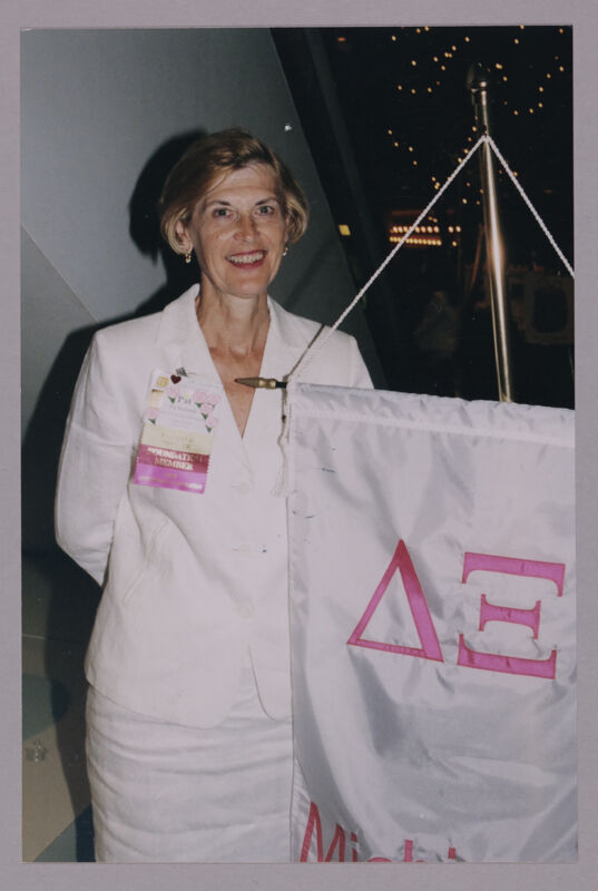 Pat Richards With Delta Xi Chapter Banner at Convention Photograph, July 4-8, 2002 (Image)
