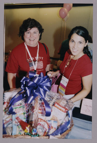 Unidentified and Michelle With Basket at Convention Photograph 1, July 4-8, 2002 (image)