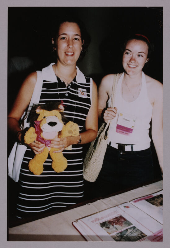 July 4-8 Unidentified and Michele With Stuffed Lion at Convention Photograph 1 Image