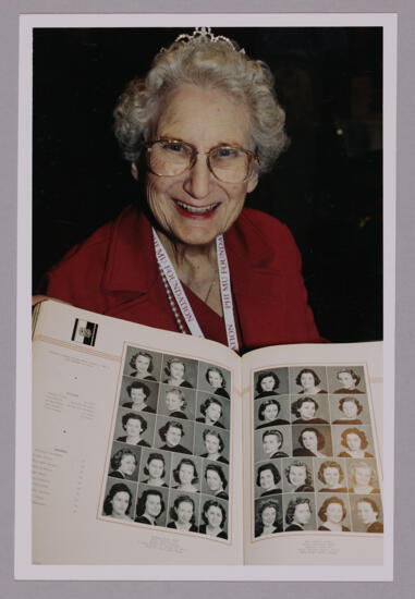 Anne Nelson With Old Yearbook at Convention Photograph 1, July 4-8, 2002 (image)