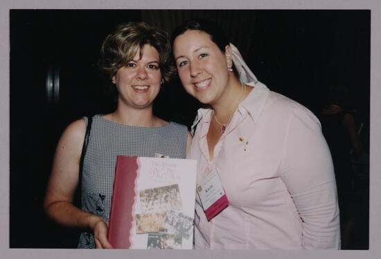 Unidentified and Kayla With History Book at Convention Photograph, July 4-8, 2002 (image)