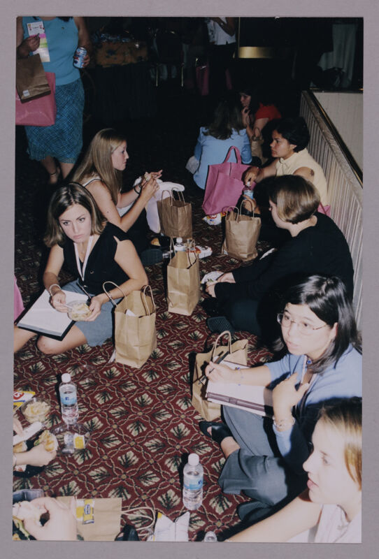 Cahoy, Wu, and Others Eating Bag Lunches at Convention Photograph, July 4-8, 2002 (Image)
