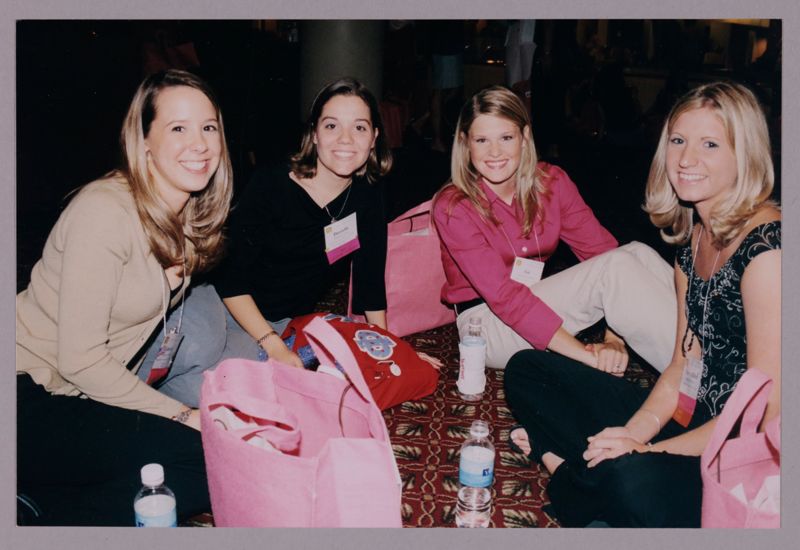 Four Phi Mus Sitting on Floor at Convention Photograph, July 4-8, 2002 (Image)