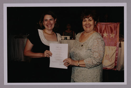 Gamma Delta Chapter Member and Mary Jane Johnson With Certificate at Convention Photograph, July 4-8, 2002 (image)