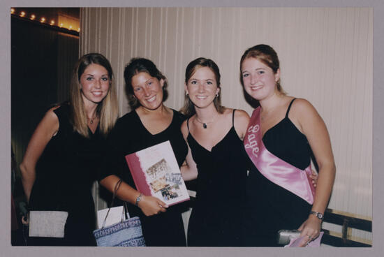 Four Phi Mus With History Book at Convention Photograph 1, July 4-8, 2002 (image)