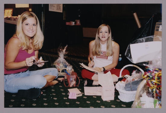 Two Phi Mus With Baskets at Convention Photograph 1, July 4-8, 2002 (image)