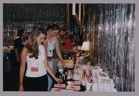 Phi Mus Examining Merchandise at Convention Photograph 1, July 4-8, 2002 (image)