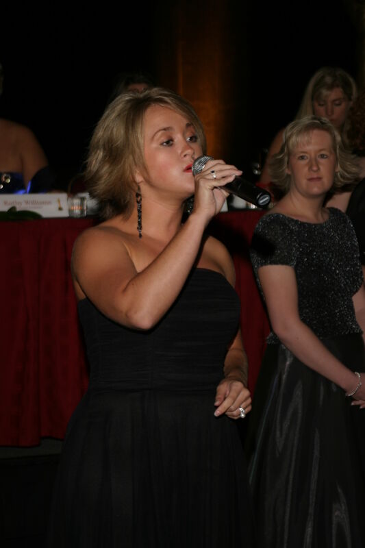 Unidentified Phi Mu Singing at Convention Carnation Banquet Photograph 1, July 11, 2004 (Image)