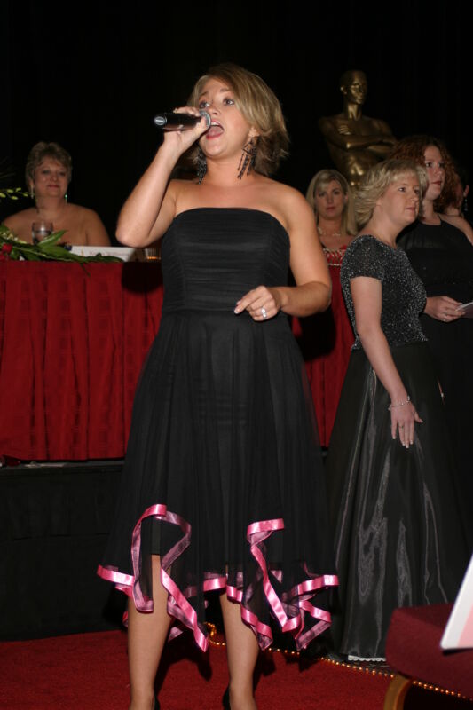 Unidentified Phi Mu Singing at Convention Carnation Banquet Photograph 3, July 11, 2004 (Image)