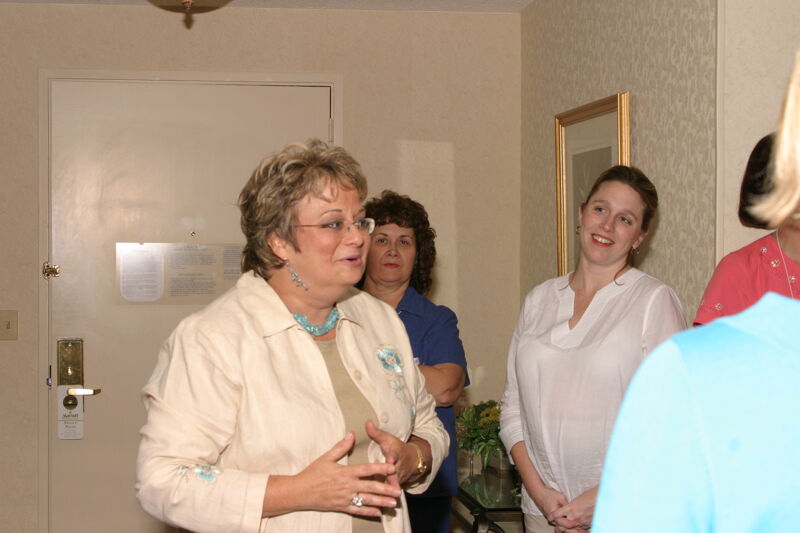 Kathy Williams Socializing at Convention Officers' Party Photograph 1, July 7, 2004 (Image)