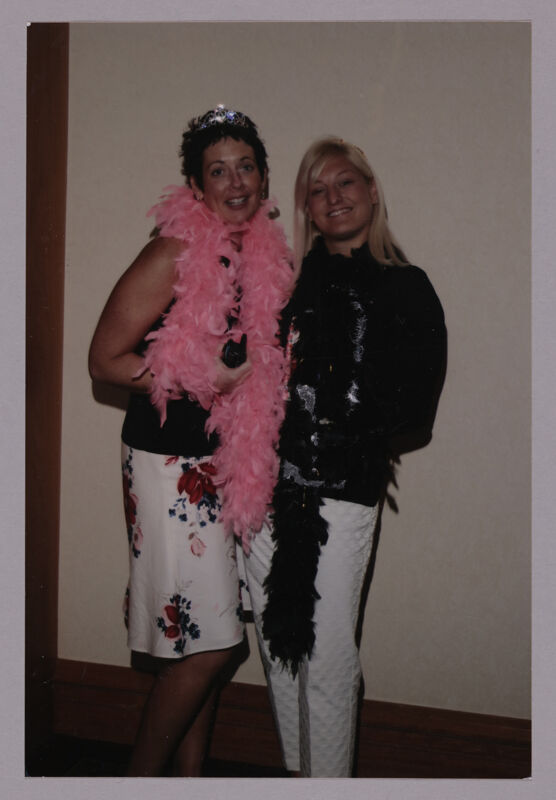 Jen Wooley and Kris Bridges Wearing Feather Boas at Convention Photograph 1, July 8, 2004 (Image)