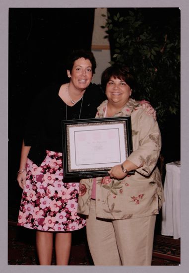 Jen Wooley and Unidentified With Award at Convention Photograph, July 8-11, 2004 (image)