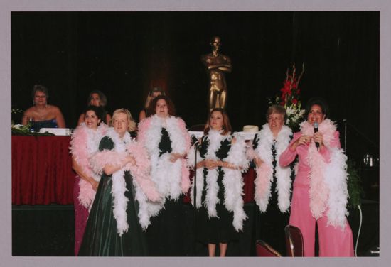 Choir in Feather Boas at Convention Carnation Banquet Photograph 1, July 11, 2004 (image)