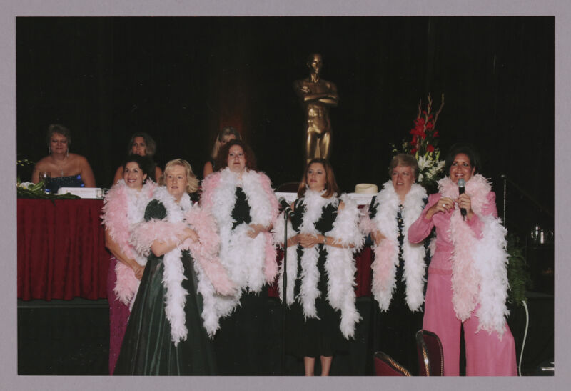 Choir in Feather Boas at Convention Carnation Banquet Photograph 1, July 11, 2004 (Image)