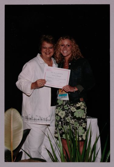 Kathy Williams and Delta Omega Chapter Member With Certificate at Convention Photograph, July 8-11, 2004 (image)