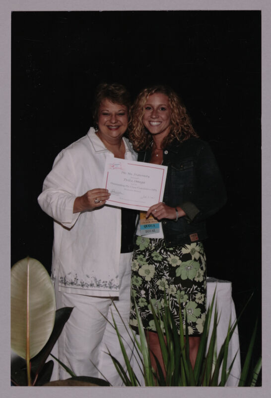 Kathy Williams and Delta Omega Chapter Member With Certificate at Convention Photograph, July 8-11, 2004 (Image)