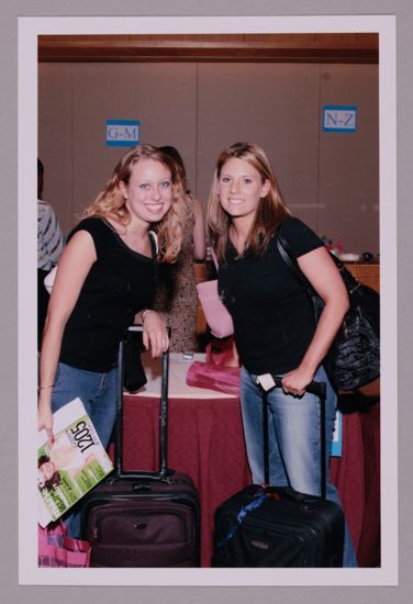 Two Phi Mus Registering at Convention Photograph 1, July 8, 2004 (image)