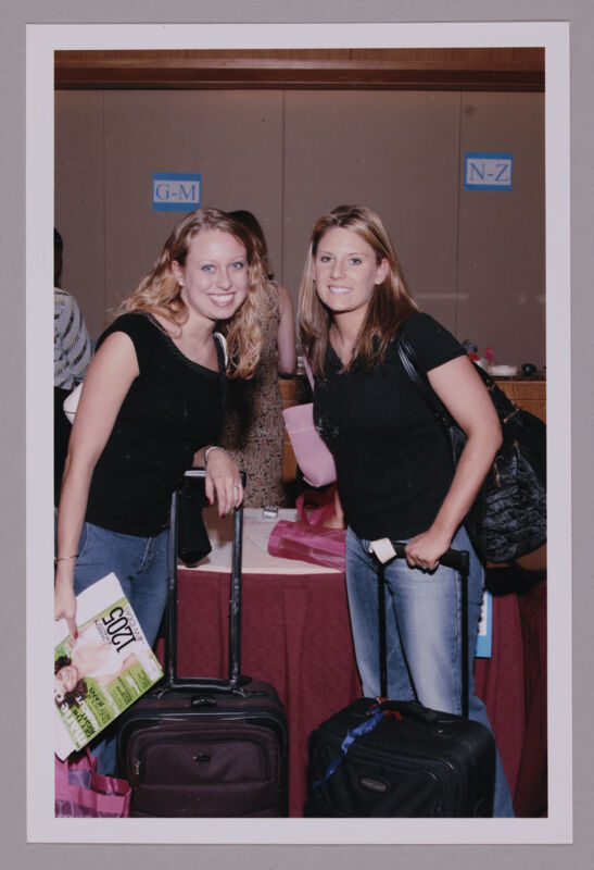 Two Phi Mus Registering at Convention Photograph 1, July 8, 2004 (Image)