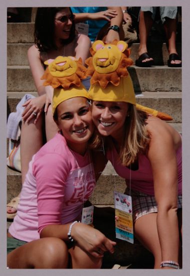 Jess and Liz Sherman Wearing Lion Hats at Convention Photograph 1, July 10, 2004 (image)