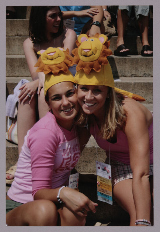 Jess and Liz Sherman Wearing Lion Hats at Convention Photograph 1, July 10, 2004 (Image)