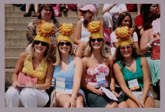 Unidentified, Lindsey, Katie, and Lauren Wearing Lion Hats at Convention Photograph 1, July 10, 2004 (image)