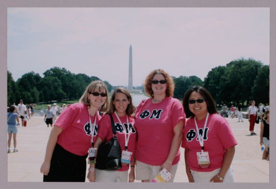 Group of Four in Phi Mu Shirts by Washington Monument During Convention Photograph 1, July 10, 2004 (image)