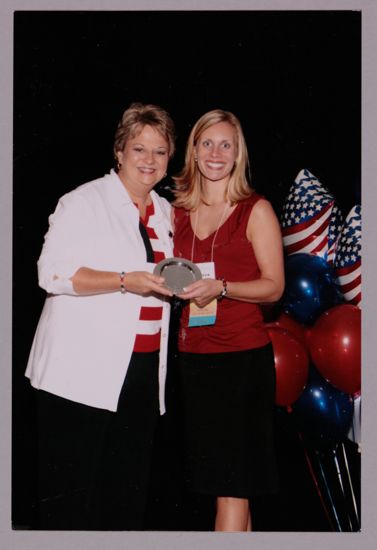 Kathy Williams and Unidentified With Award at Convention Photograph 1, July 8, 2004 (image)