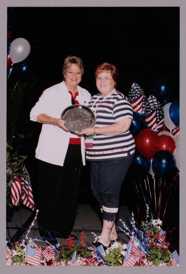 Kathy Williams and Unidentified With Award at Convention Photograph 2, July 8, 2004 (image)