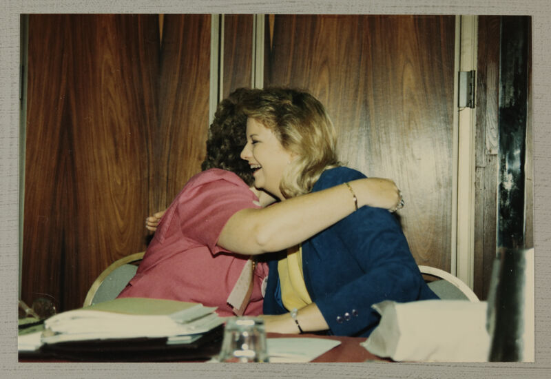 Unidentified Phi Mu Hugging Kathy Williams at Convention Photograph, July 6-10, 1986 (Image)