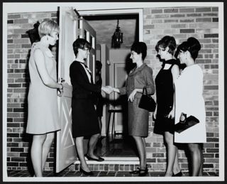 Epsilon Mu Chapter Members Greeting Guests at the Door Photograph