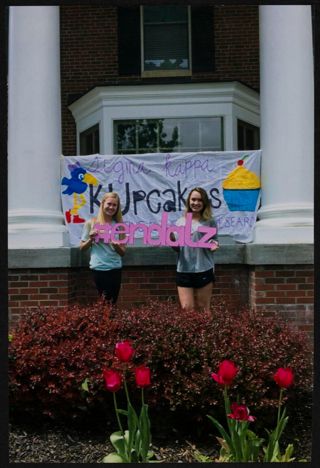 Two Xi Chapter Members With KUpcakes Sign Photograph 1, 2010s