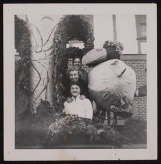 Poe, Allen, and Penick Behind Homecoming Decorations Photograph, 1952