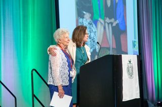 Cheri De Jong and Patricia Mills on Stage at 2016 Convention Photograph 1, July 8, 2016