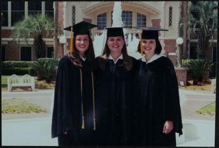 Three Unidentified Omega Chapter Members in Graduation Gowns Photograph, c. 1998