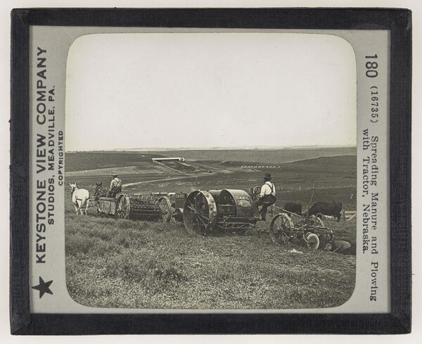 Spreading Manure and Plowing with Tractor, Nebraska.