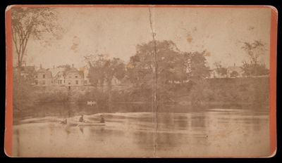 [Untitled photograph of river scene and two men on canoe]