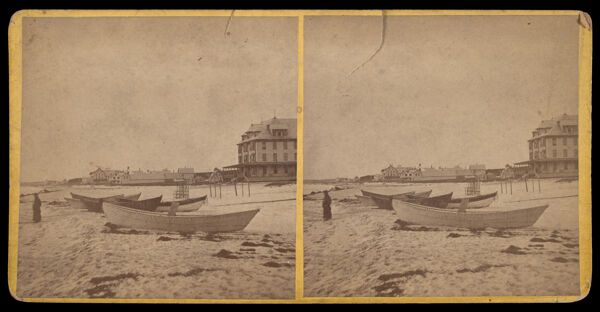 [Building in the background and boats docked on sand in Old Orchard, Me.]