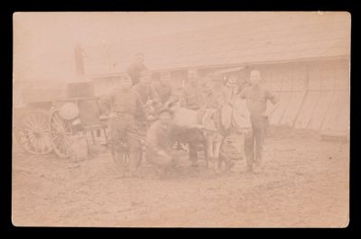 [A Group of Men Posing with a Donkey Pulling a Cart]