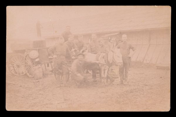 [A Group of Men Posing with a Donkey Pulling a Cart]