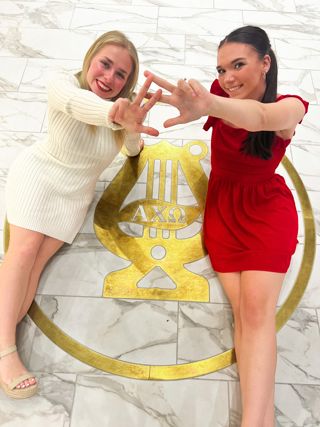 Collegians in Lobby of 5635 Castle Creek Parkway Headquarters Photograph