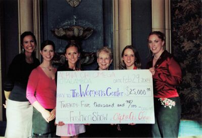 Iota Lambda (Texas Christian University) members present a check to The Women's Center, photograph, 2004
