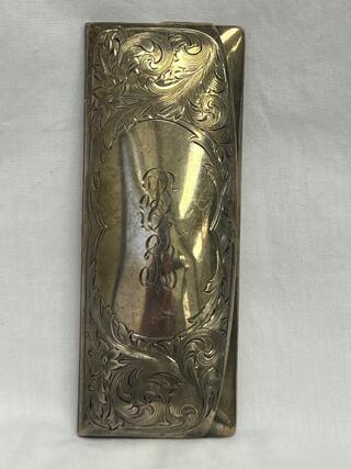 Silver eyeglass case with monogram belonging to Founder Bessie Grooms Keenan