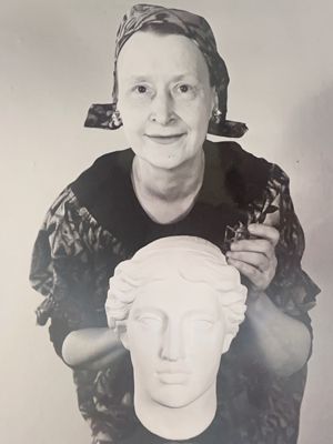 Marcia Clapp DeRocco (Alpha Chi, Butler University) and bust of Hera, photograph