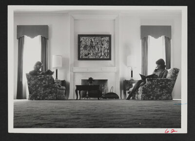 Two Phi Chapter Members Studying in Living Room Photograph