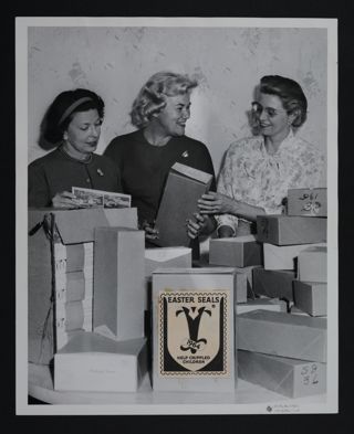 Three Gamma Mu Gamma Chapter Members Packing Easter Seals Photograph, c. 1964