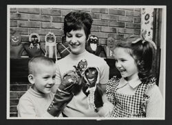 Alumnae and Children Playing With Puppets Photograph, 1973