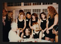 Collegians Around Alumna in White Dress Photograph, 1997