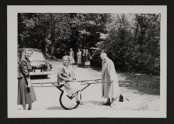 National Council Members Playing with Cart at Council Meeting Photograph, June 1950